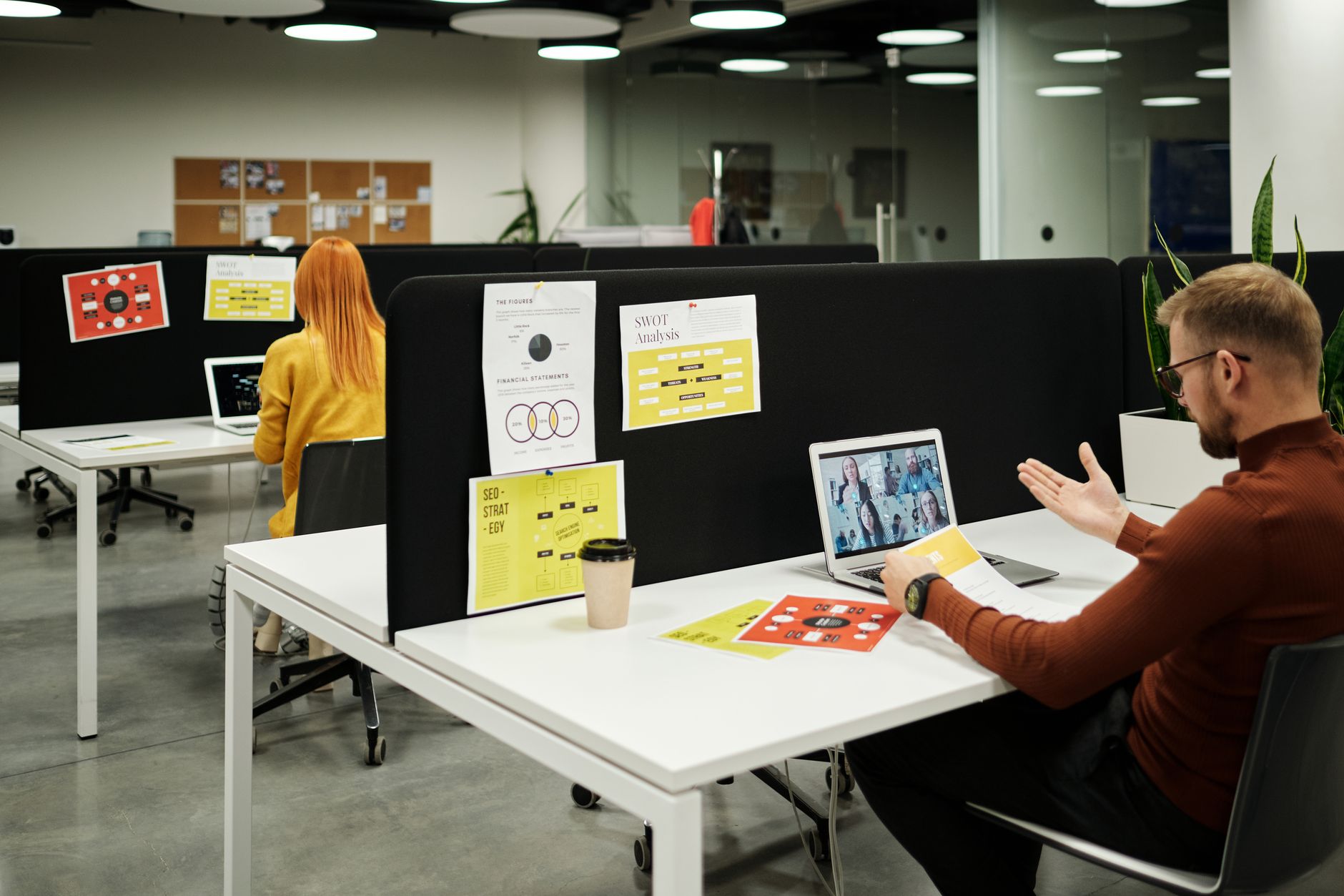Team members working together at computers representing shared access and permission management