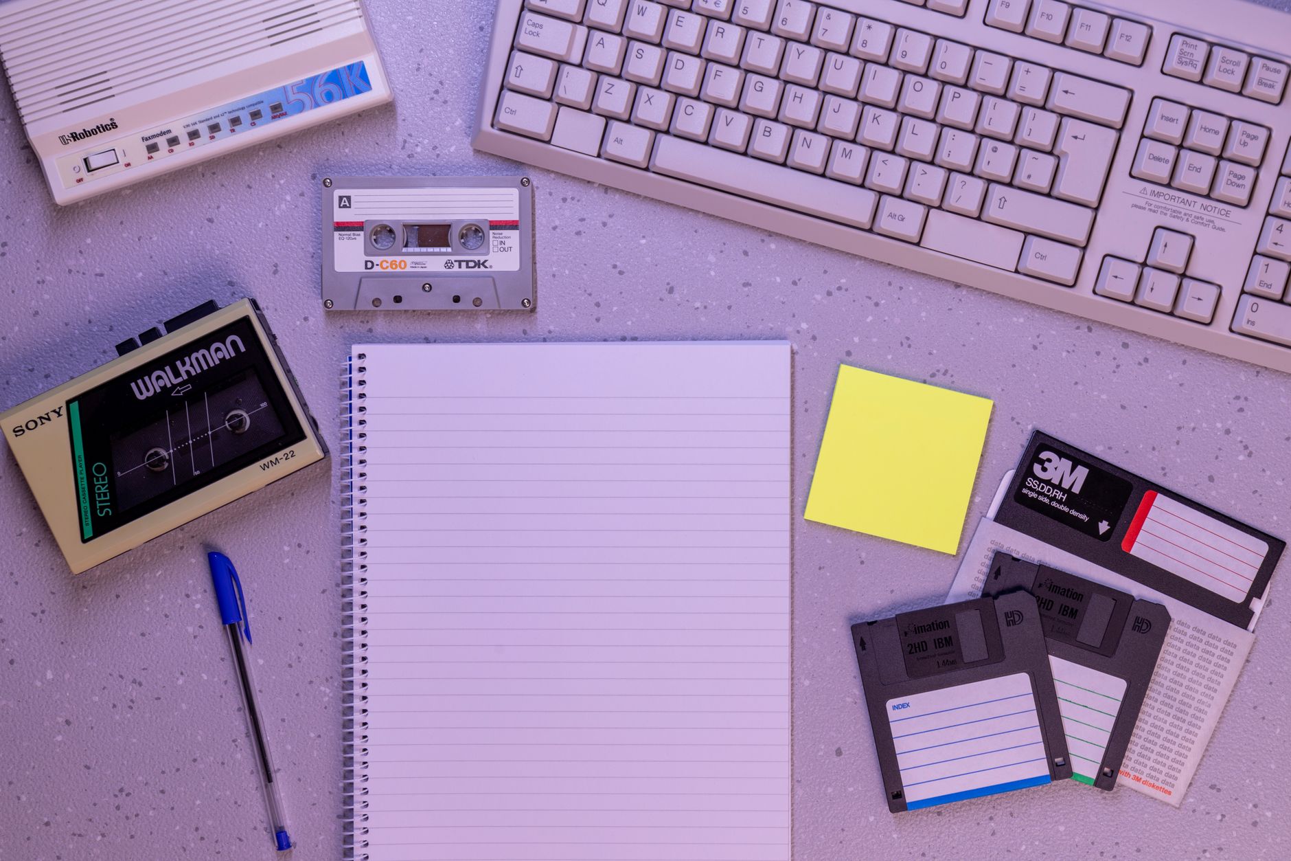 A laptop and mobile device side by side representing note syncing across devices