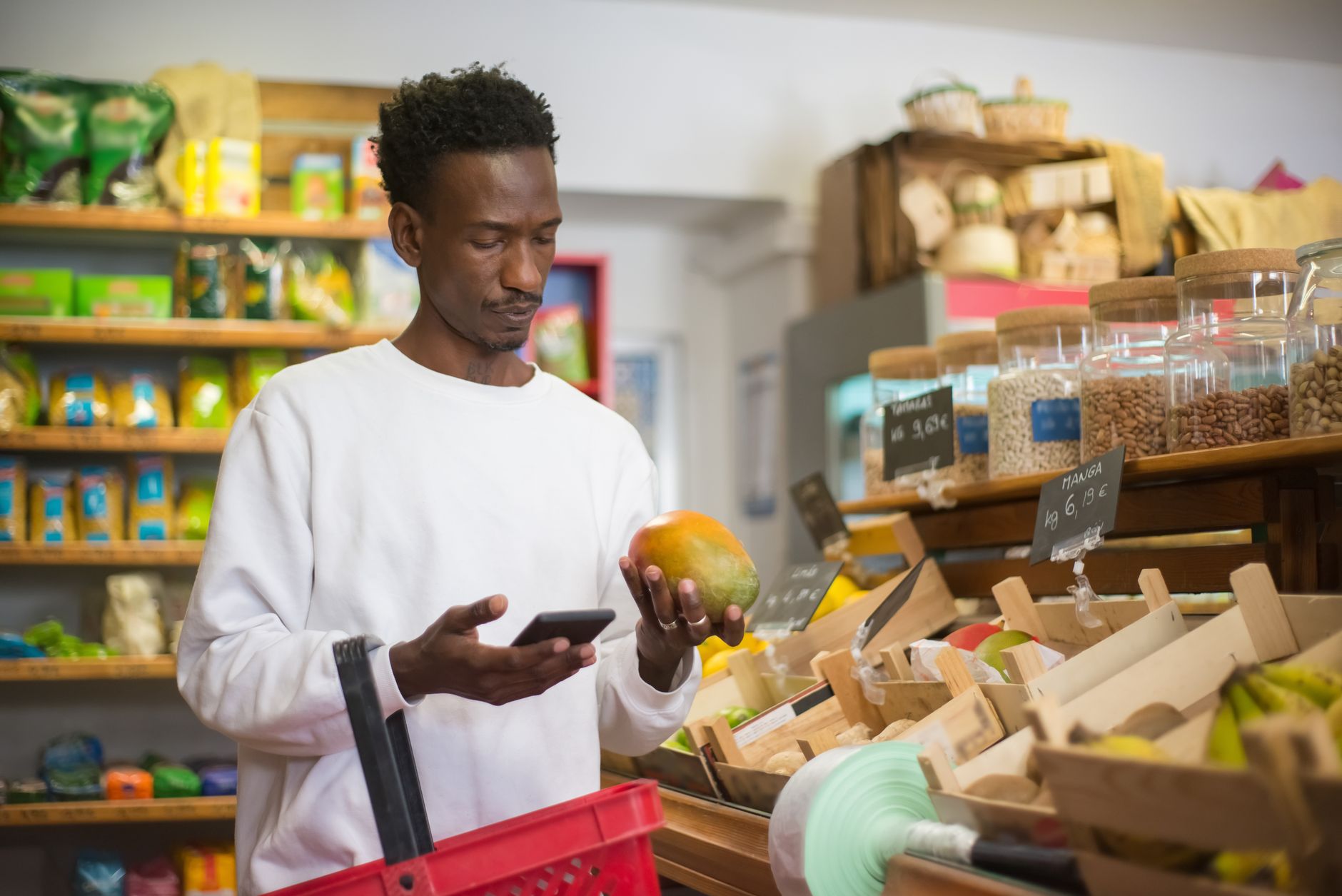 Person scanning a barcode on a grocery product with a mobile device