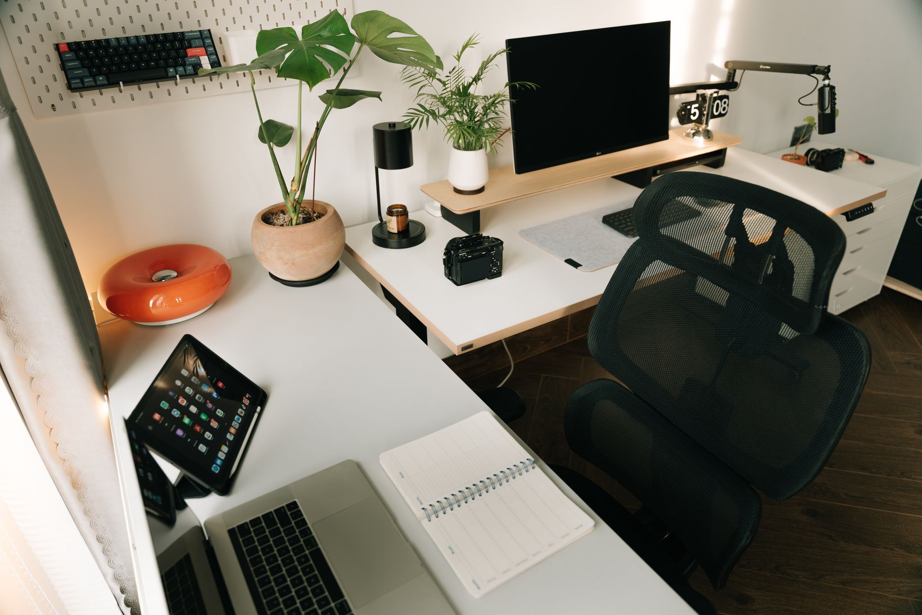 Clean home office desk setup with monitor and laptop for remote work