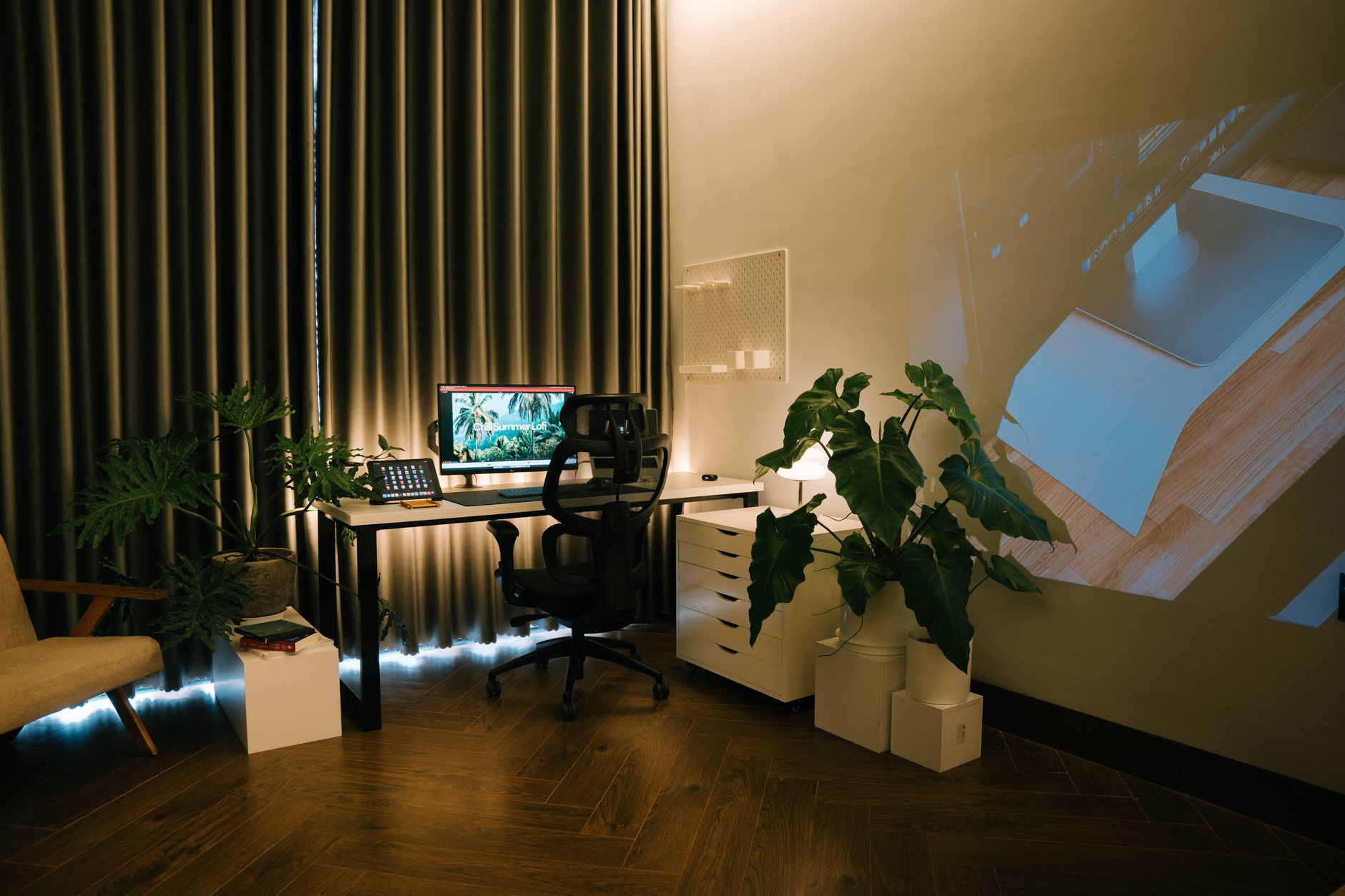Minimal home office with computer monitor running background software services