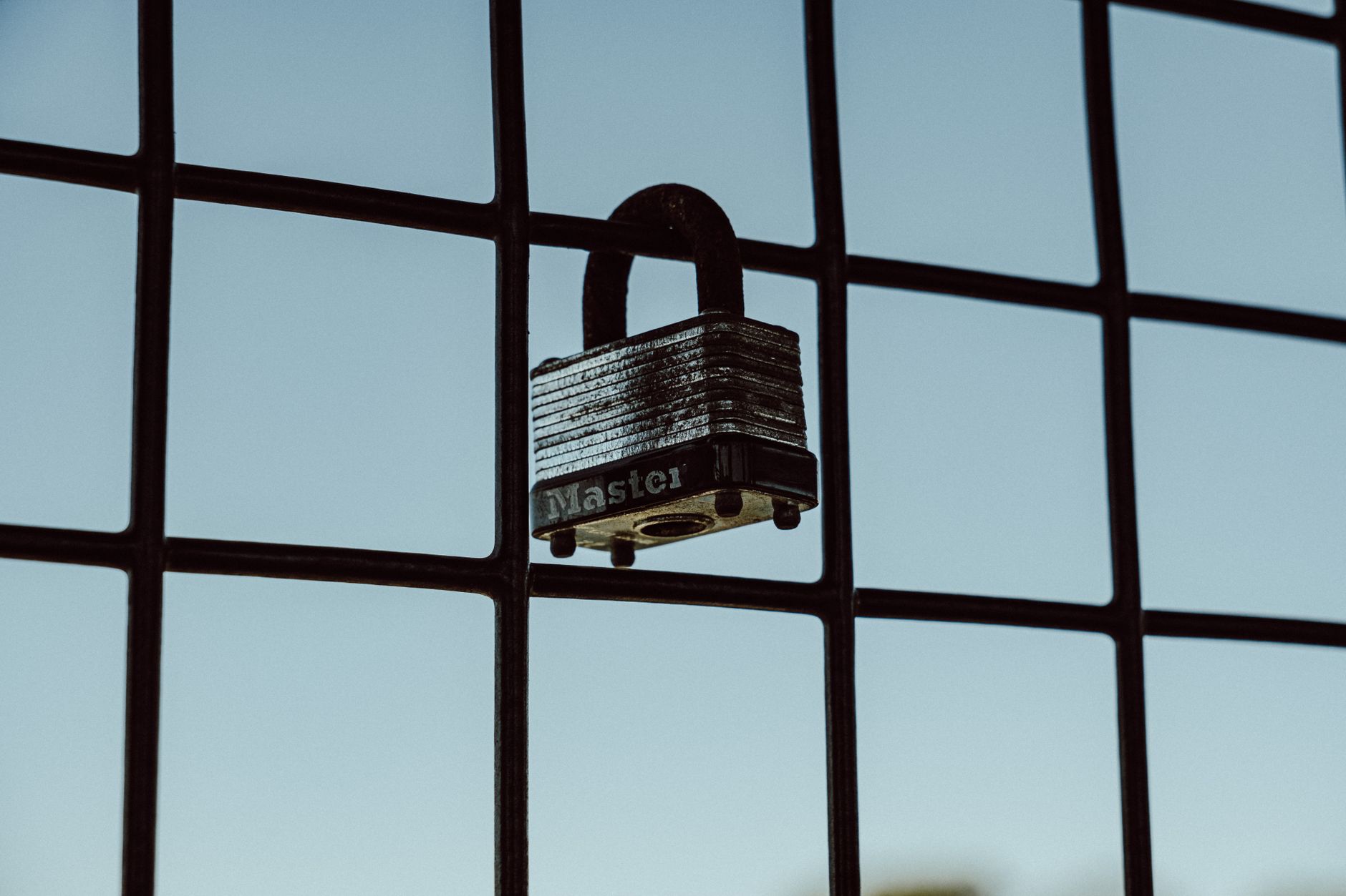 A padlock on a network cable representing server security and access control