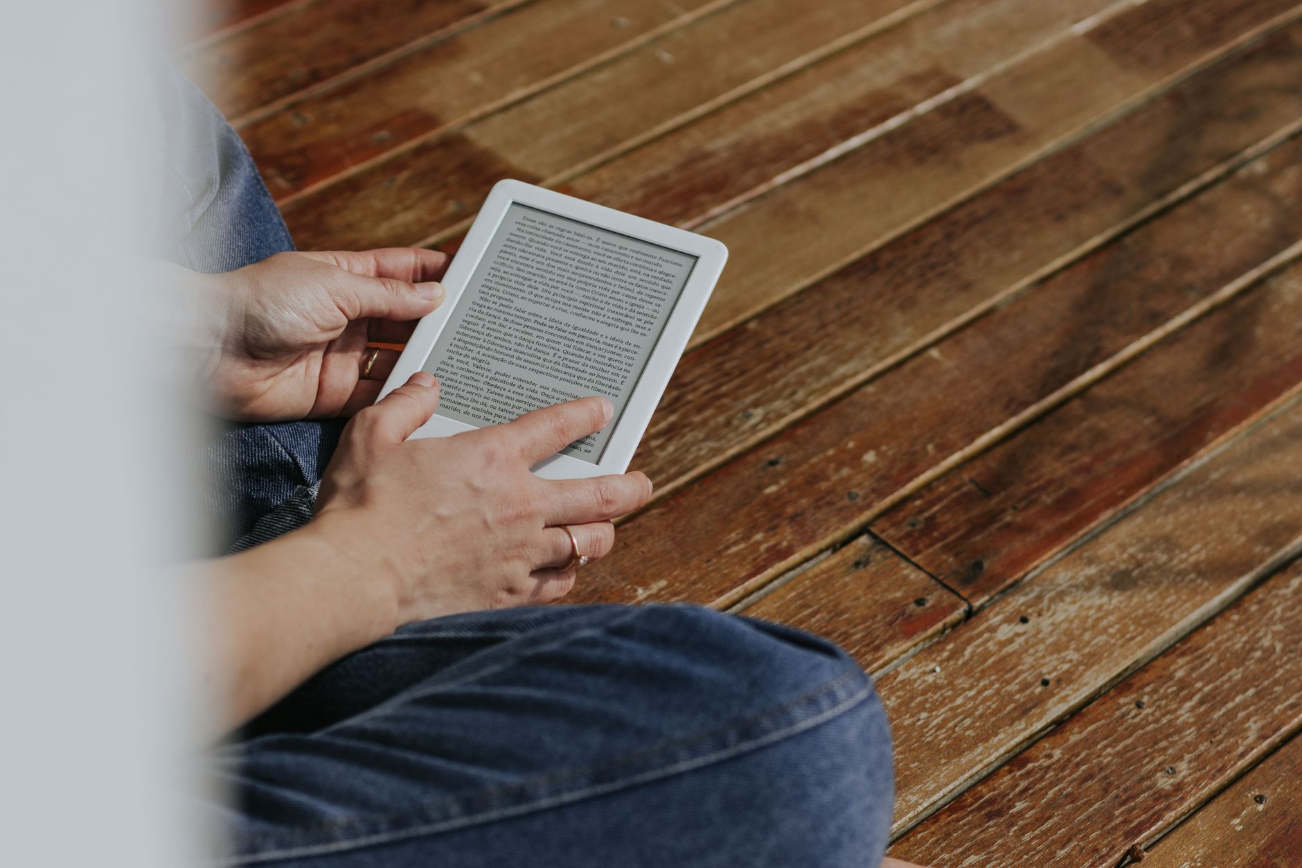 Person reading an eBook on a tablet connected to a personal library server