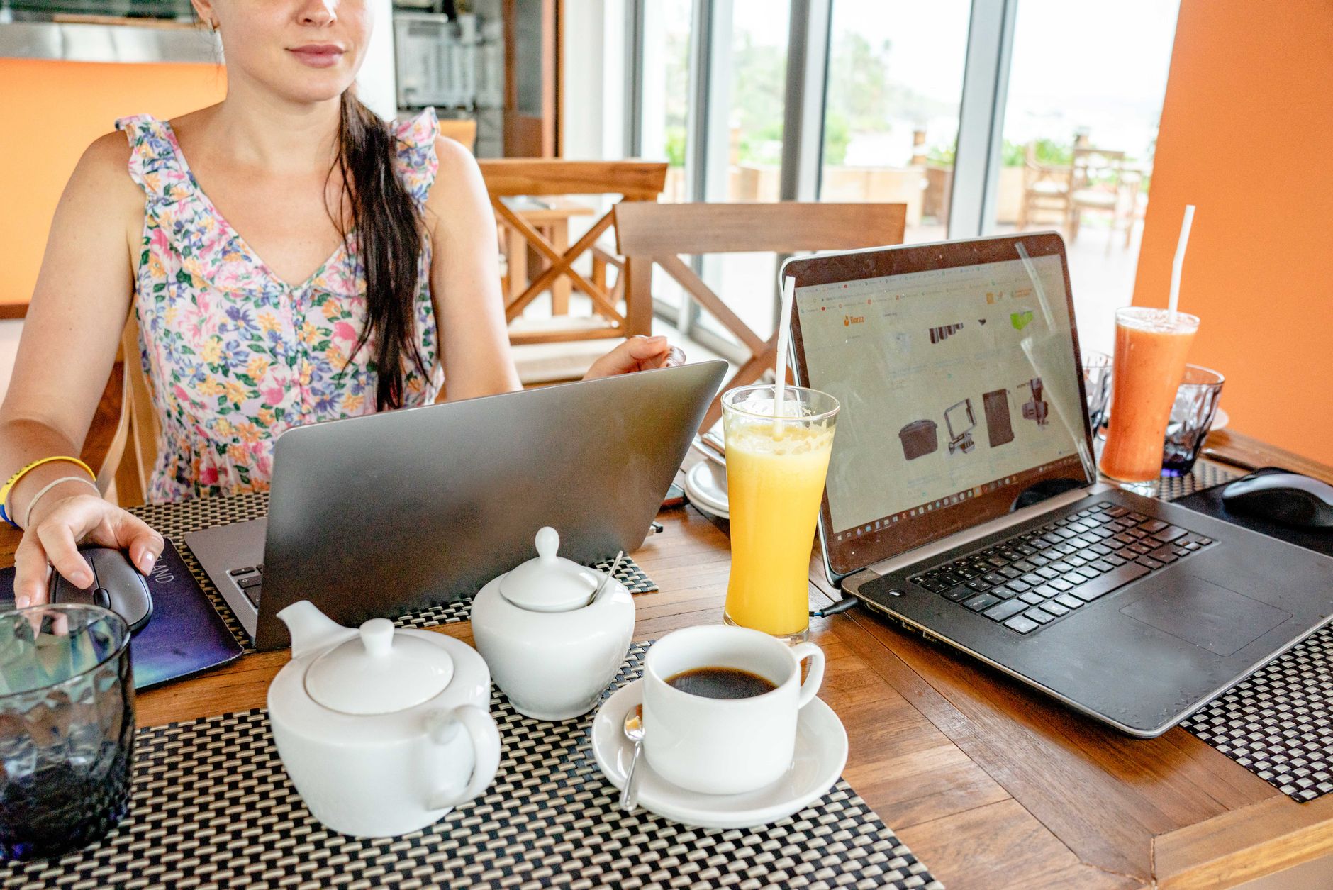 Person working on a laptop remotely accessing a browser-based code editor