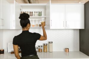 Set Up Grocy as a Self-Hosted Household Inventory Manager Organized pantry shelves with labeled food containers representing household inventory management
