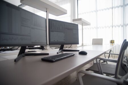Set Up Penpot as a Self-Hosted Figma Alternative A designer working at a monitor with a UI design tool open on screen