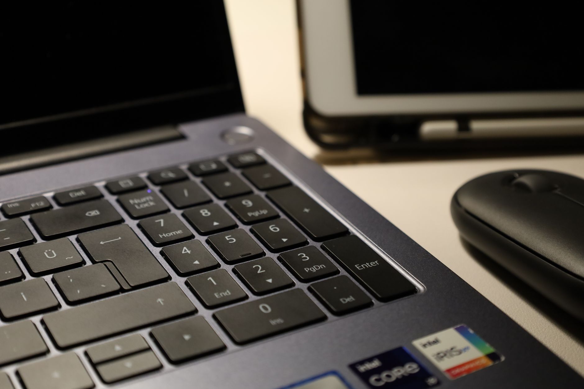 Person working at a desktop computer in a home office setup