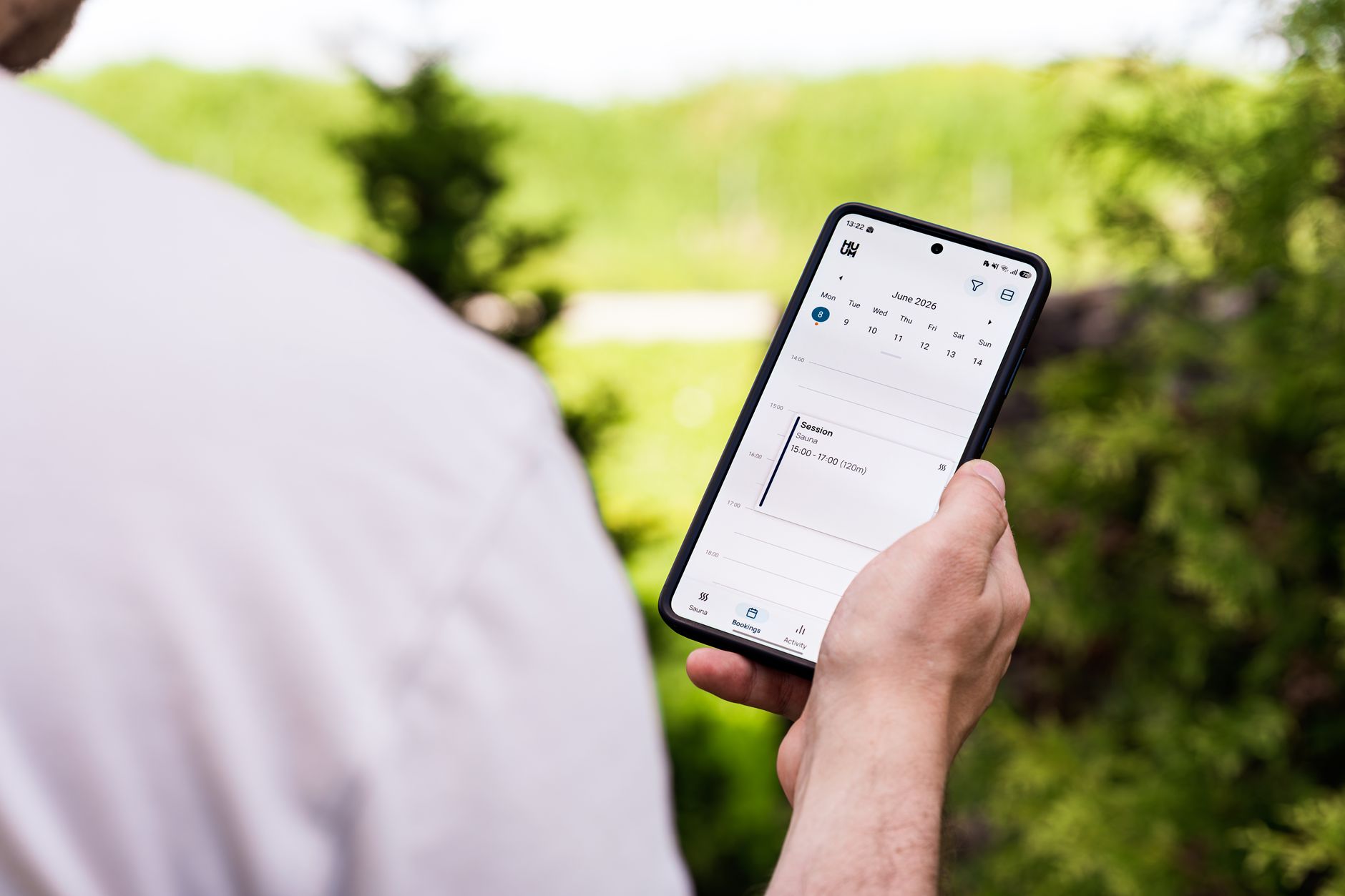 A smartphone displaying a calendar app syncing with a remote server