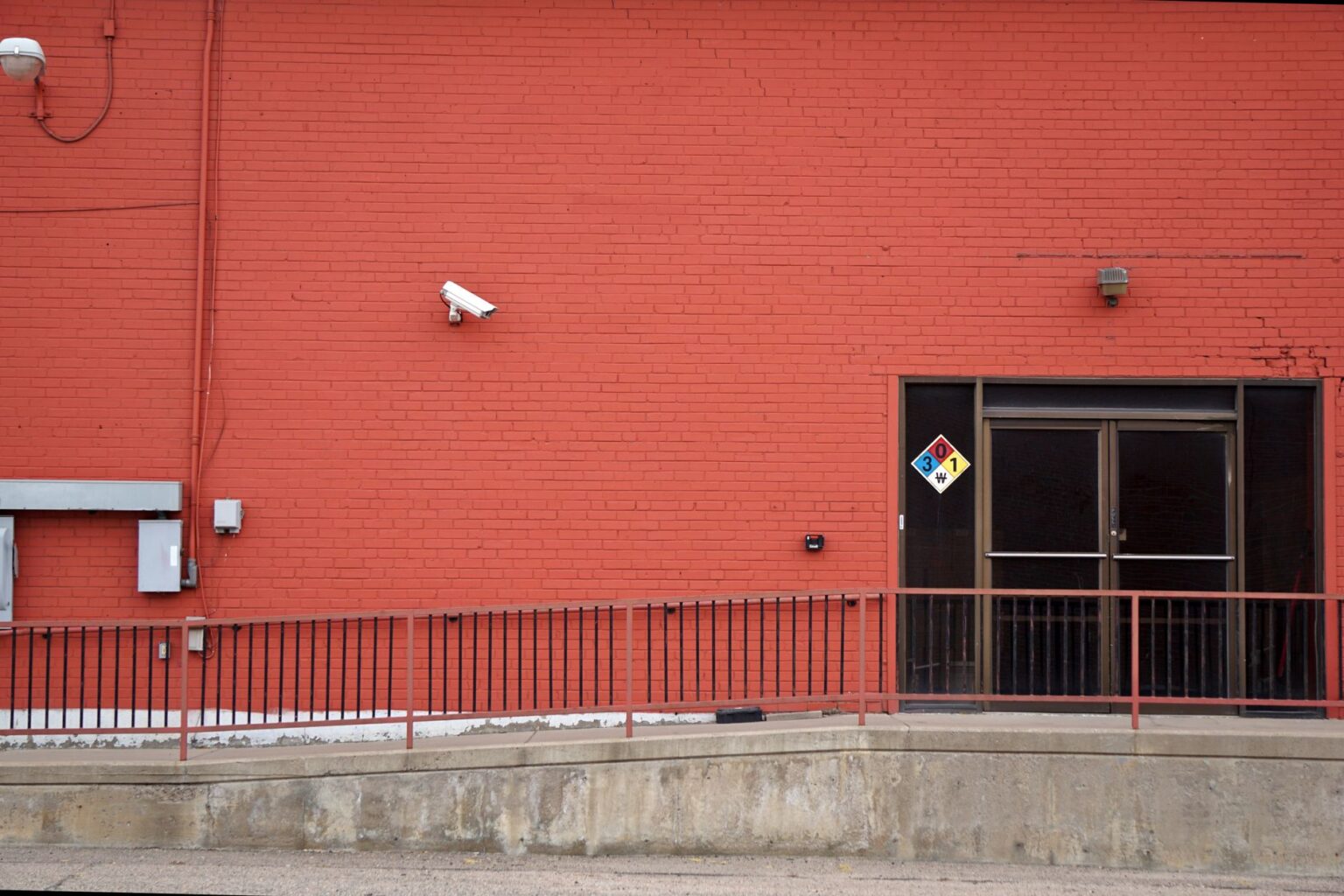Set Up Frigate as a Self-Hosted NVR with AI Detection Outdoor security camera mounted on a building exterior