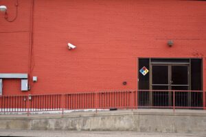 Outdoor security camera mounted on a building exterior