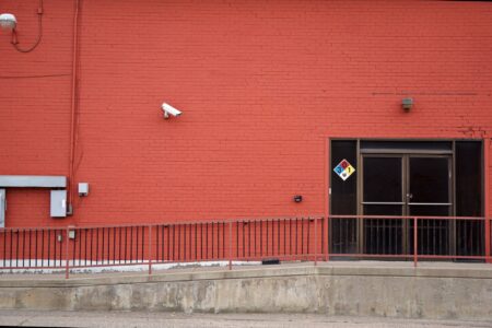 Outdoor security camera mounted on a building exterior