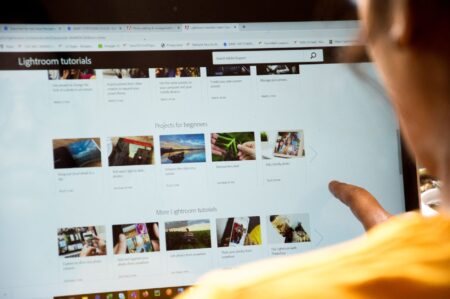 A computer screen displaying a photo management interface with a grid of organized images