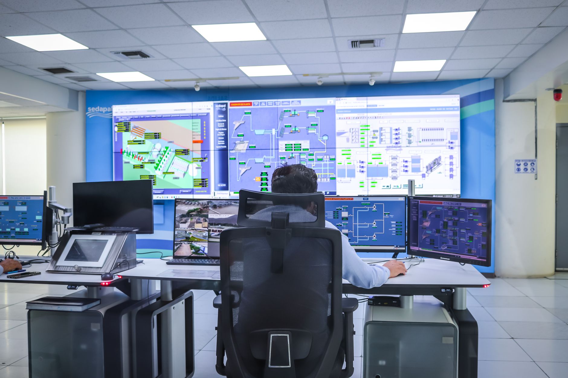 Computer screen displaying network and system monitoring graphs and metrics