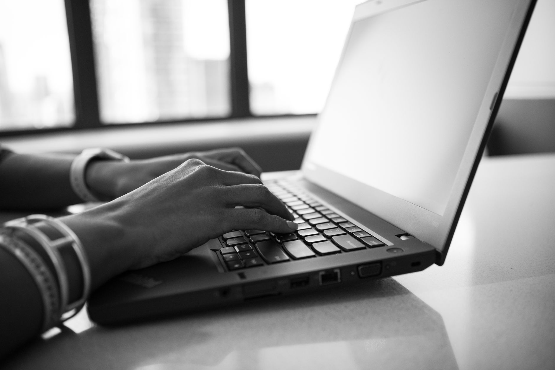 A person typing commands into a laptop terminal window during a server configuration session
