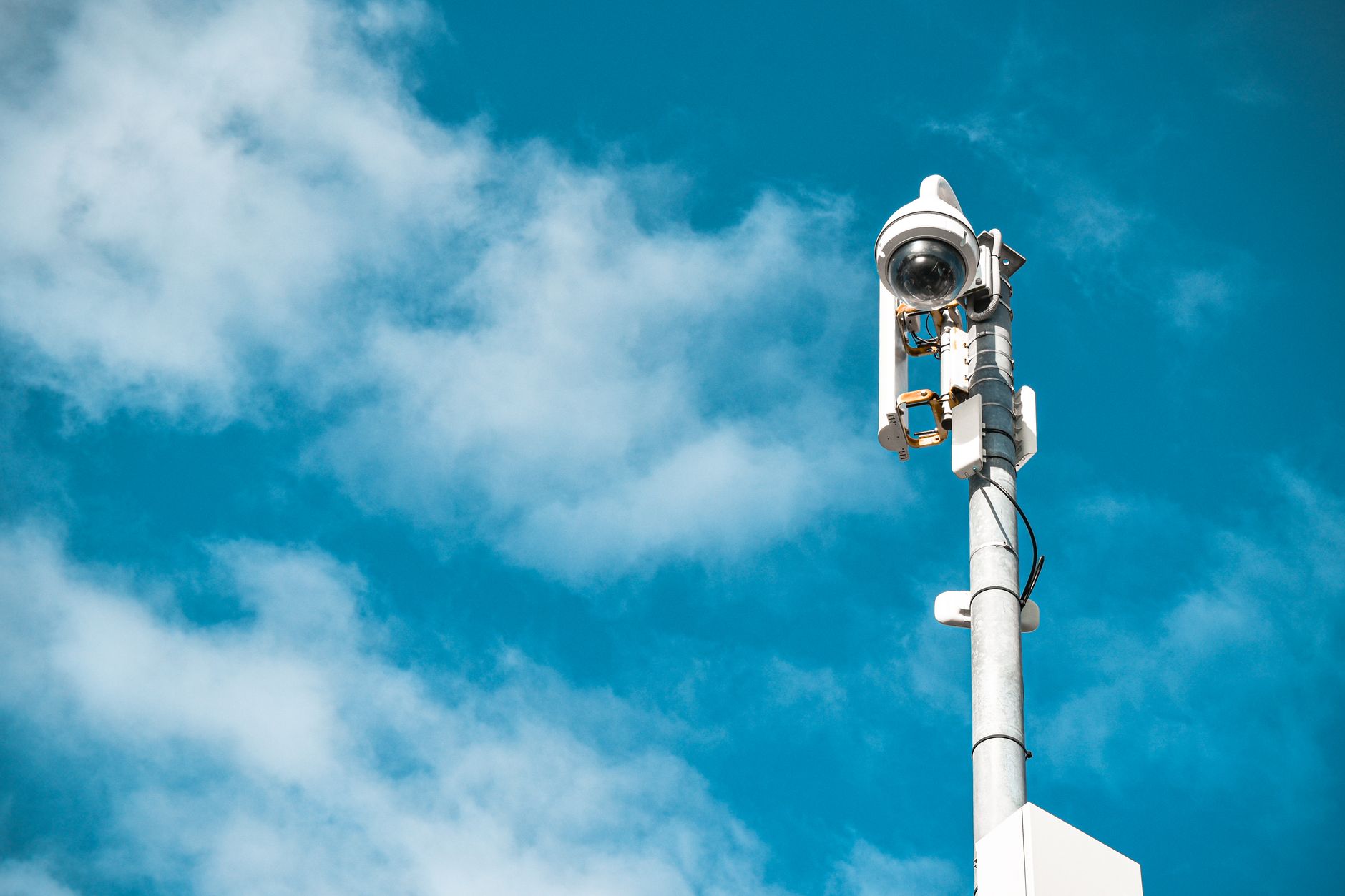Security monitor displaying camera feeds in a home setup
