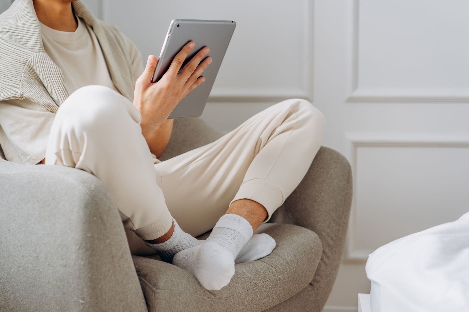 A person reading on a tablet device connected to a personal media server