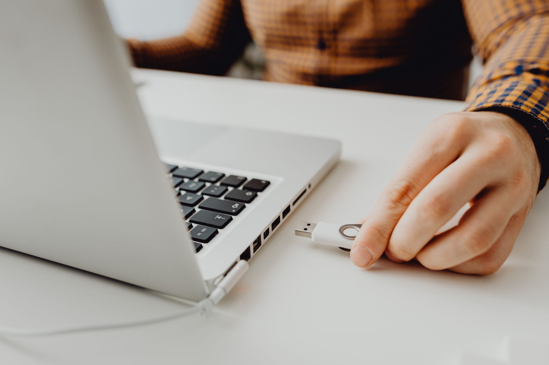Person managing files on a laptop connected to a self-hosted sync service